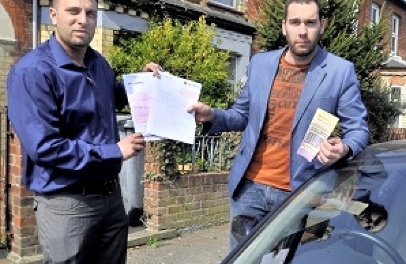 Council Candidate Imraan Ishtiaq, left, supports Gareth Aldridge over his permit